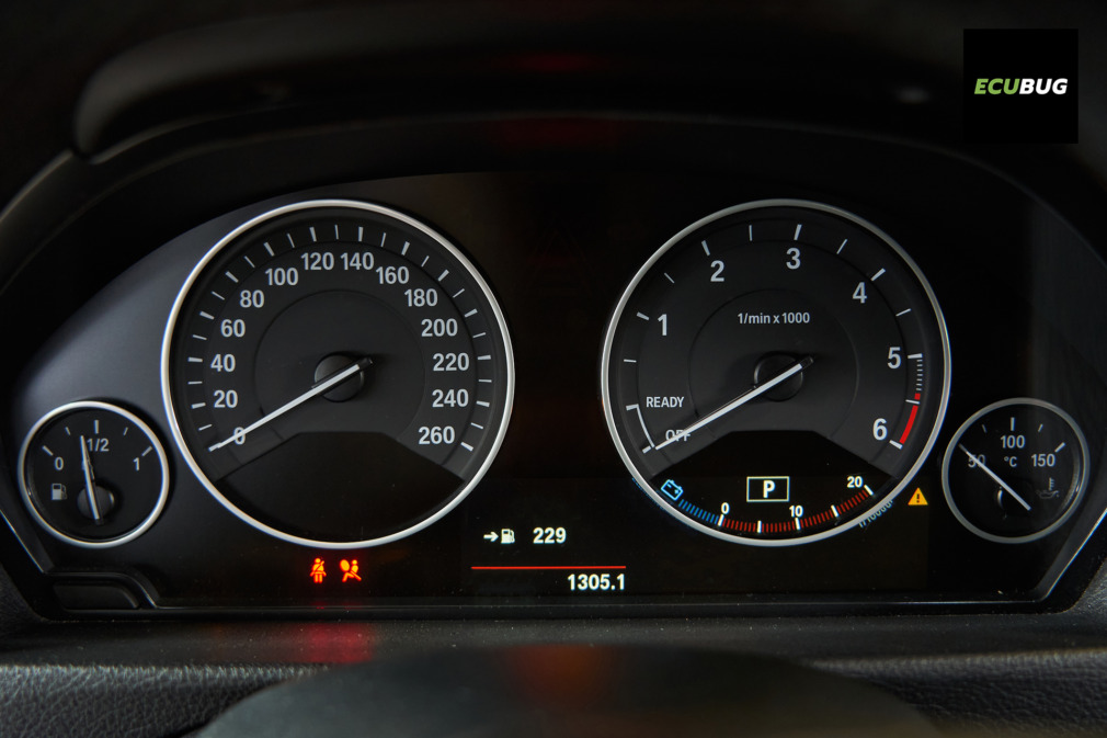 Red SRS Airbag warning light illuminated on a car dashboard indicating a system fault.