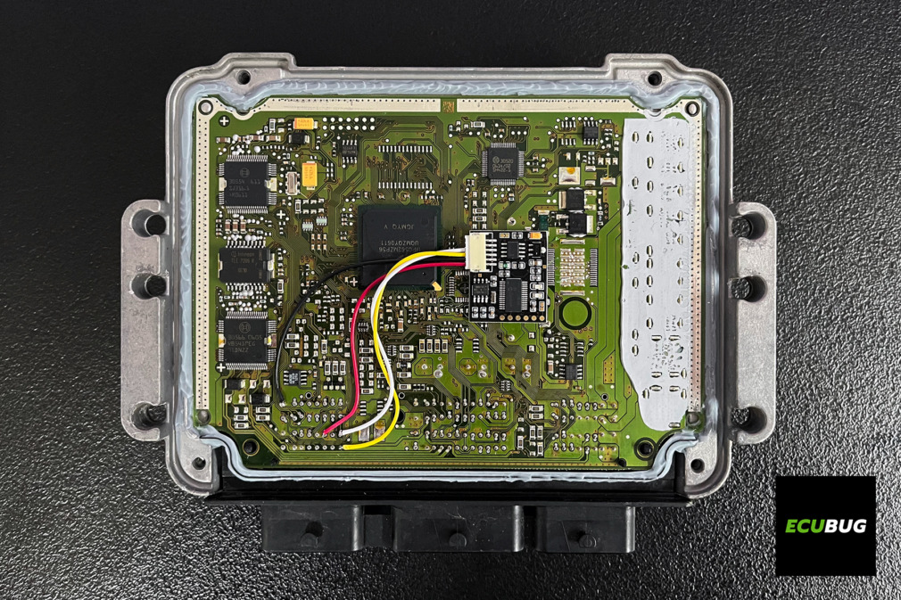 Bosch EDC16 ECU with an immobilizer emulator installed on the bench for an engine swap.