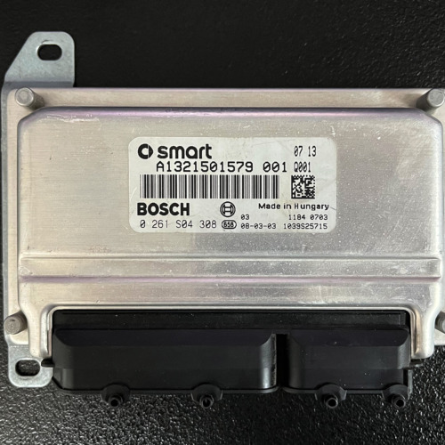 Bosch ME7.7.0 engine ECU from Smart 451 ForTwo on the bench, top view showing the connector and identification label with part number 0261S04308